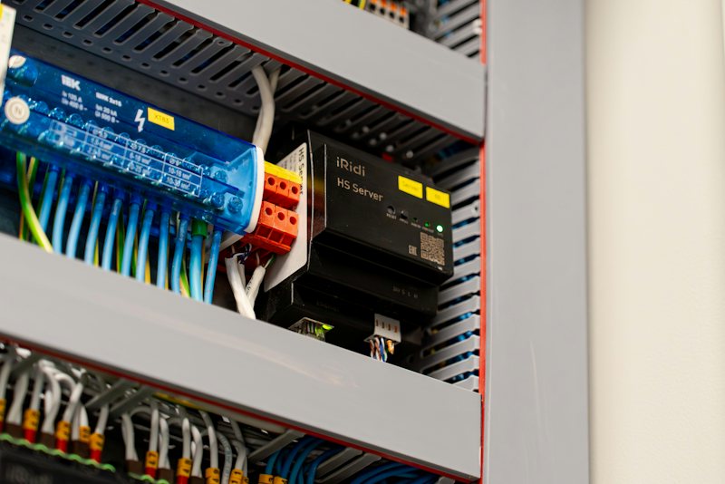 PLC modules and terminal wiring inside an industrial control panel
